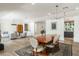Bright living area with wood floors, seamlessly connecting to the dining area with neutral decor at 5112 N 41St St, Phoenix, AZ 85018