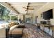 A covered patio with comfortable outdoor seating and a ceiling fan at 5112 N 41St St, Phoenix, AZ 85018