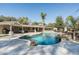 Sparkling pool with a rock waterfall feature enhances this outdoor living space at 5112 N 41St St, Phoenix, AZ 85018