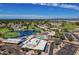 Panoramic aerial view of the community showcasing a pool, recreation center, and surrounding landscape at 520 S Sand Verbena Way, Mesa, AZ 85208