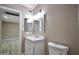 Bathroom with neutral walls, vanity, framed mirror, and toilet at 520 S Sand Verbena Way, Mesa, AZ 85208