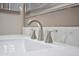 Close-up of a bathroom faucet on a modern vanity with marble-look countertop at 520 S Sand Verbena Way, Mesa, AZ 85208
