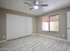 Bedroom featuring a ceiling fan, large closet, and a bright window at 520 S Sand Verbena Way, Mesa, AZ 85208
