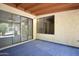 Covered patio featuring tile flooring and sliding glass doors offering seamless indoor-outdoor living at 520 S Sand Verbena Way, Mesa, AZ 85208