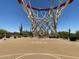 Outdoor basketball court featuring a hoop with net and surrounding desert landscape against a blue sky at 5650 E Ocupado Dr, Cave Creek, AZ 85331