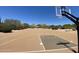 View of basketball court surrounded by desert landscaping under a blue sky at 5650 E Ocupado Dr, Cave Creek, AZ 85331