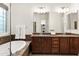 Stylish bathroom with a soaking tub and double vanity with granite countertops at 5650 E Ocupado Dr, Cave Creek, AZ 85331