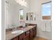 Bathroom with dual sinks, granite countertop, vanity, and decorative accents at 5650 E Ocupado Dr, Cave Creek, AZ 85331