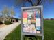 Community bulletin board displaying announcements and upcoming events in a park setting at 5650 E Ocupado Dr, Cave Creek, AZ 85331