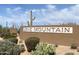 Community sign for Lone Mountain showcasing desert landscaping and bright blue sky at 5650 E Ocupado Dr, Cave Creek, AZ 85331