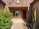 Inviting front porch with desert landscaping, brick walkway, and attractive entryway at 5650 E Ocupado Dr, Cave Creek, AZ 85331