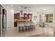 Bright, open kitchen features a large island, stainless steel appliances, and a connected dining area at 5650 E Ocupado Dr, Cave Creek, AZ 85331