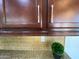 Close-up of kitchen cabinet, granite countertop, and decorative backsplash at 5650 E Ocupado Dr, Cave Creek, AZ 85331
