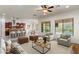 Open-concept living room with kitchen, dining, living, and a view of the pool at 5650 E Ocupado Dr, Cave Creek, AZ 85331