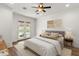 Serene bedroom with French doors to pool, soft colors, and ample natural light at 5650 E Ocupado Dr, Cave Creek, AZ 85331