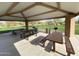 Covered picnic area with picnic tables and barbeque grills in a grassy area at 5650 E Ocupado Dr, Cave Creek, AZ 85331