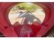 View through a playground slide, showcasing the park's walking path and landscaping at 5650 E Ocupado Dr, Cave Creek, AZ 85331