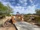 Playground bridge surrounded by desert landscape under a bright blue sky at 5650 E Ocupado Dr, Cave Creek, AZ 85331