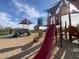 Community playground with multiple slides, covered structures, and desert landscape in the background at 5650 E Ocupado Dr, Cave Creek, AZ 85331