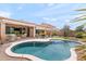Backyard pool is surrounded by an extended patio and beautiful desert landscaping at 5650 E Ocupado Dr, Cave Creek, AZ 85331