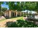 Large grassy backyard with covered patio, desert landscaping, and a pool for fun and relaxing at 5758 E Fox St, Mesa, AZ 85205