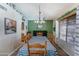 Charming dining room featuring a checkered tablecloth, chandelier, and seamless access to kitchen at 5758 E Fox St, Mesa, AZ 85205