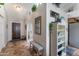 Inviting foyer with tile flooring, arched doorways, and decorative accents at 5758 E Fox St, Mesa, AZ 85205