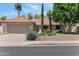 Charming home with a two-car garage, desert landscaping, and a well-maintained tile roof at 5758 E Fox St, Mesa, AZ 85205