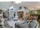 Open concept living space with stylish decor, seamless flow to the kitchen and dining areas, and ample natural light at 5758 E Fox St, Mesa, AZ 85205