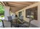 Covered patio offers an outdoor dining area with backyard views and easy access to the house at 5758 E Fox St, Mesa, AZ 85205
