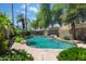 Backyard with swimming pool, desert landscaping, and well-manicured lawn for entertaining at 5758 E Fox St, Mesa, AZ 85205