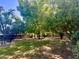A private backyard with mature trees providing shade and a serene atmosphere at 6525 N 3Rd St, Phoenix, AZ 85012
