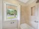 Bathtub and shower with window, showing a view outside, and shower niche at 6525 N 3Rd St, Phoenix, AZ 85012