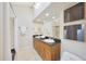 Bathroom featuring a double sink, tile floors, and granite countertop at 6525 N 3Rd St, Phoenix, AZ 85012