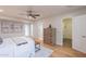 Neutral bedroom with hardwood floors, ceiling fan, closet, and art on the walls at 6525 N 3Rd St, Phoenix, AZ 85012
