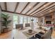 Inviting dining space featuring hardwood floors, beams, and fireplace at 6525 N 3Rd St, Phoenix, AZ 85012