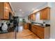 Kitchen features custom cabinets, granite counters, and stainless steel appliances at 6525 N 3Rd St, Phoenix, AZ 85012