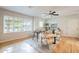 Living area with a ceiling fan, wooden floors and large window at 6525 N 3Rd St, Phoenix, AZ 85012