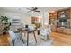 Cozy living area boasts a ceiling fan, built-in bookcase and wooden floors at 6525 N 3Rd St, Phoenix, AZ 85012