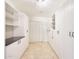 Pantry with built-in storage, white cabinets, and tile flooring at 6525 N 3Rd St, Phoenix, AZ 85012