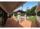 A covered patio with a tile floor and a view of the backyard and pool at 6525 N 3Rd St, Phoenix, AZ 85012