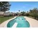 A beautiful private pool with a diving board and patio area for entertaining at 6525 N 3Rd St, Phoenix, AZ 85012