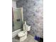 Bathroom with retro patterned wallpaper and standard fixtures at 730 N Karen Dr, Chandler, AZ 85224