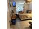 Cluttered bedroom with a TV, bed and bedside table at 730 N Karen Dr, Chandler, AZ 85224