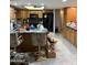 Bright kitchen features wood cabinetry, eat-in countertop, and modern appliances at 730 N Karen Dr, Chandler, AZ 85224