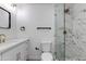 Bathroom featuring marble tile shower, modern vanity with gold fixtures, and clean design at 7810 E Via Camello -- # 72, Scottsdale, AZ 85258