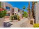 Inviting exterior of a multi-story building featuring lush landscaping and charming staircases at 7810 E Via Camello -- # 72, Scottsdale, AZ 85258