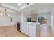 Open-concept kitchen featuring custom island, stainless steel wine fridge, and modern finishes at 7810 E Via Camello -- # 72, Scottsdale, AZ 85258