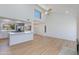Open living space with kitchen bar, modern light fixture, vaulted ceilings, and bright lighting at 7810 E Via Camello -- # 72, Scottsdale, AZ 85258