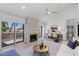 Bright living room with fireplace, vaulted ceilings, and an adjacent work nook, flooded with natural light at 7810 E Via Camello -- # 72, Scottsdale, AZ 85258